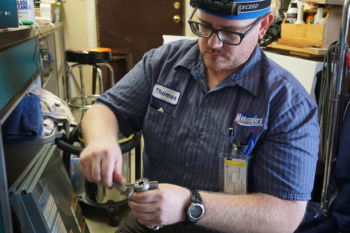 Technician working on part