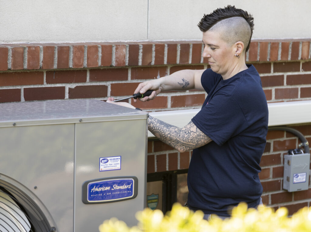 HVAC tech installing ductless mini split system
