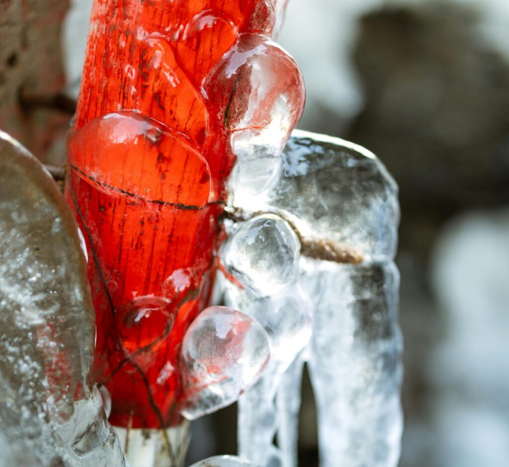 red pipe covered in ice