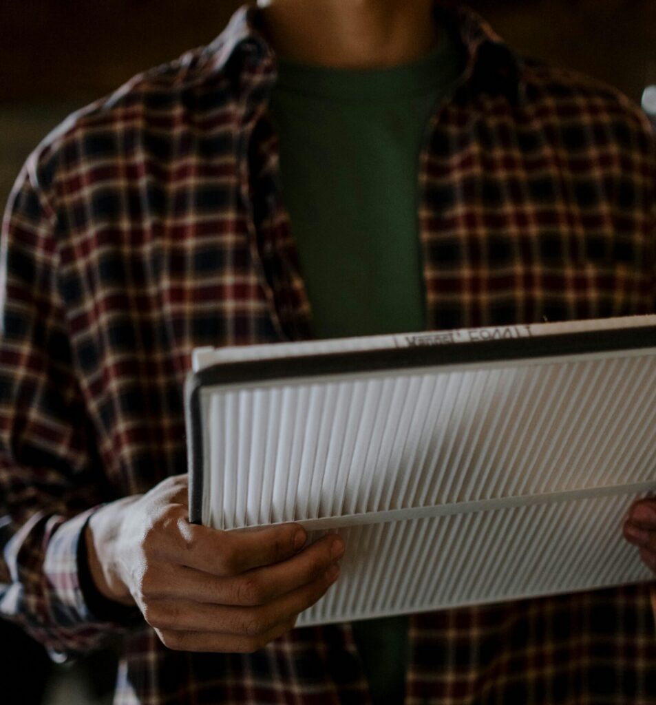 man holding HVAC air filter