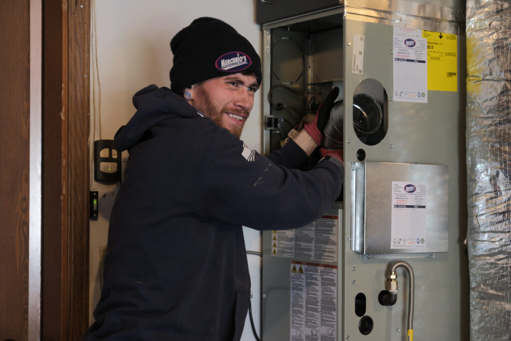 HVAC tech installing a new furnace