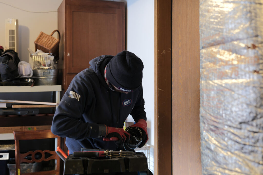 HVAC tech installing a new HVAC scrubber