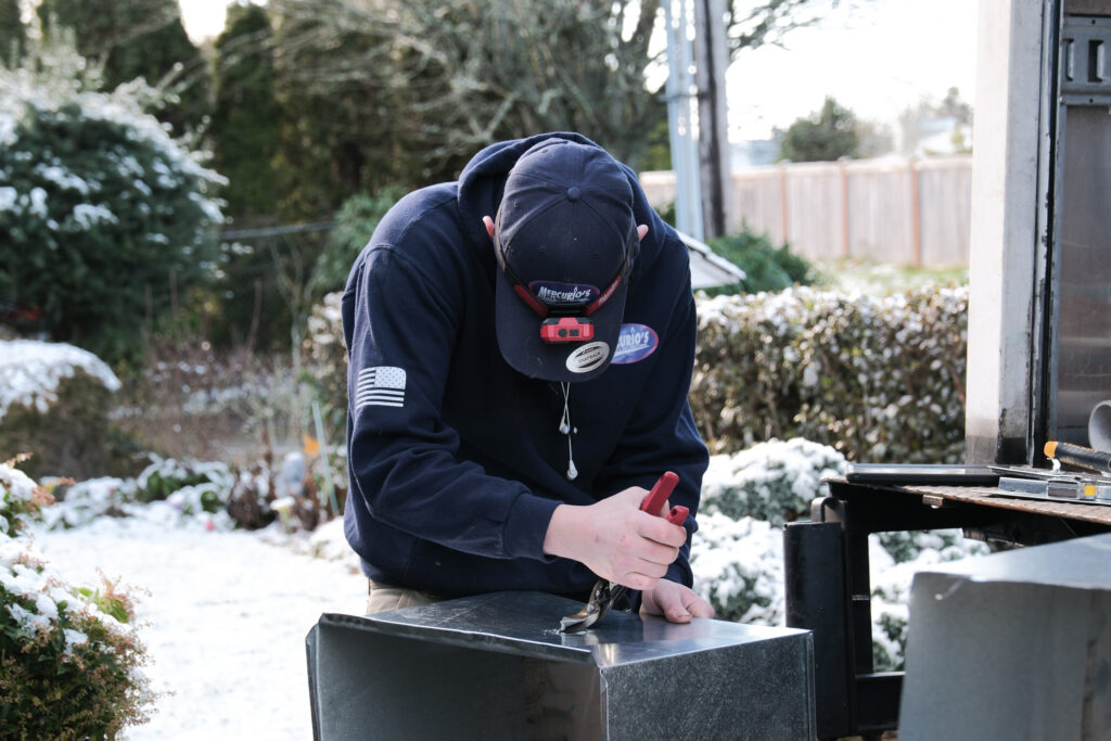 HVAC tech repairing ductwork