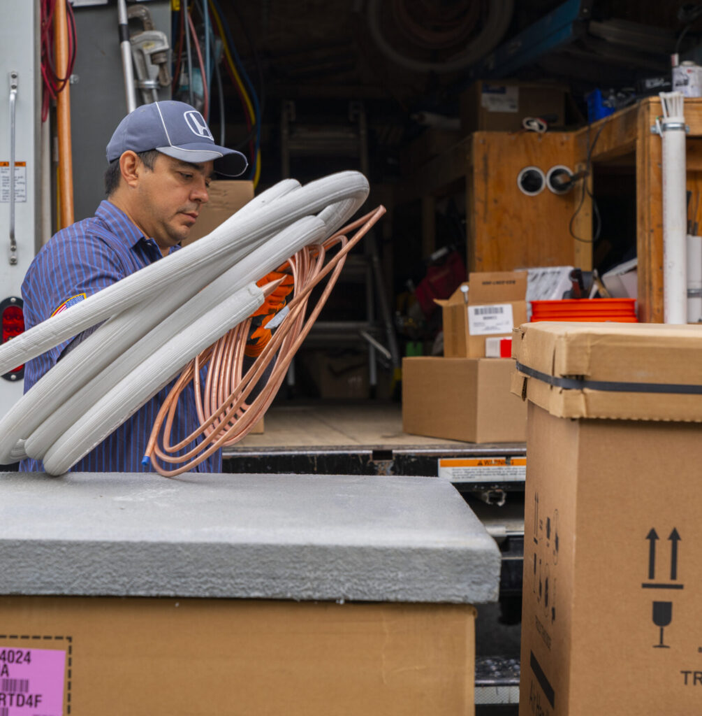 plumber loading up maintenance van