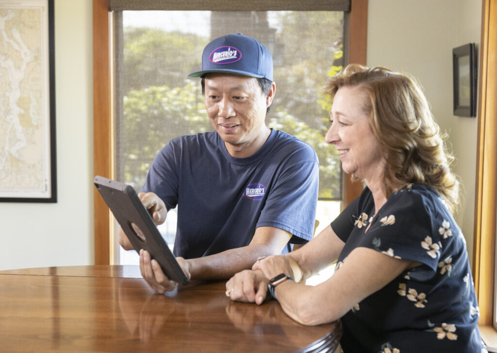 HVAC tech working with customer