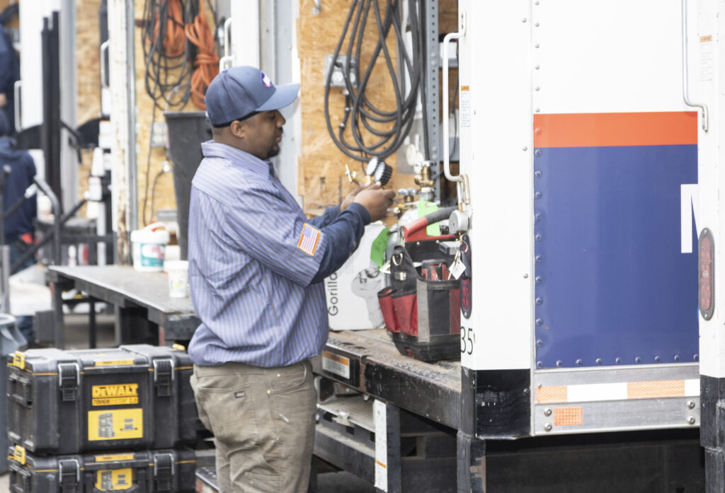 plumber gearing up truck before leaving