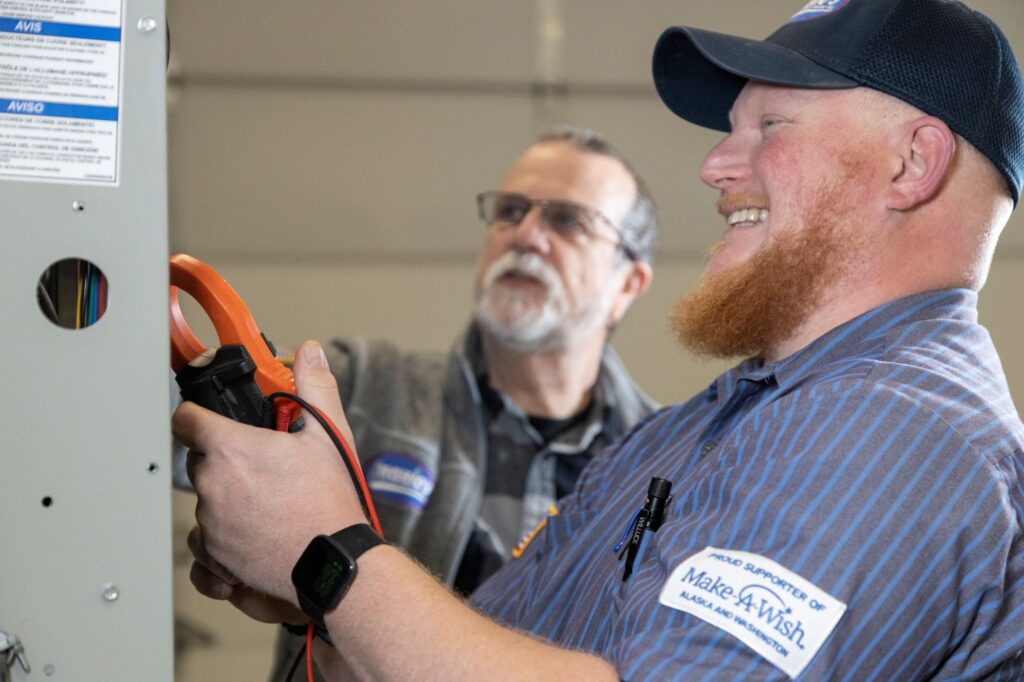 furnace tech speaking with customer